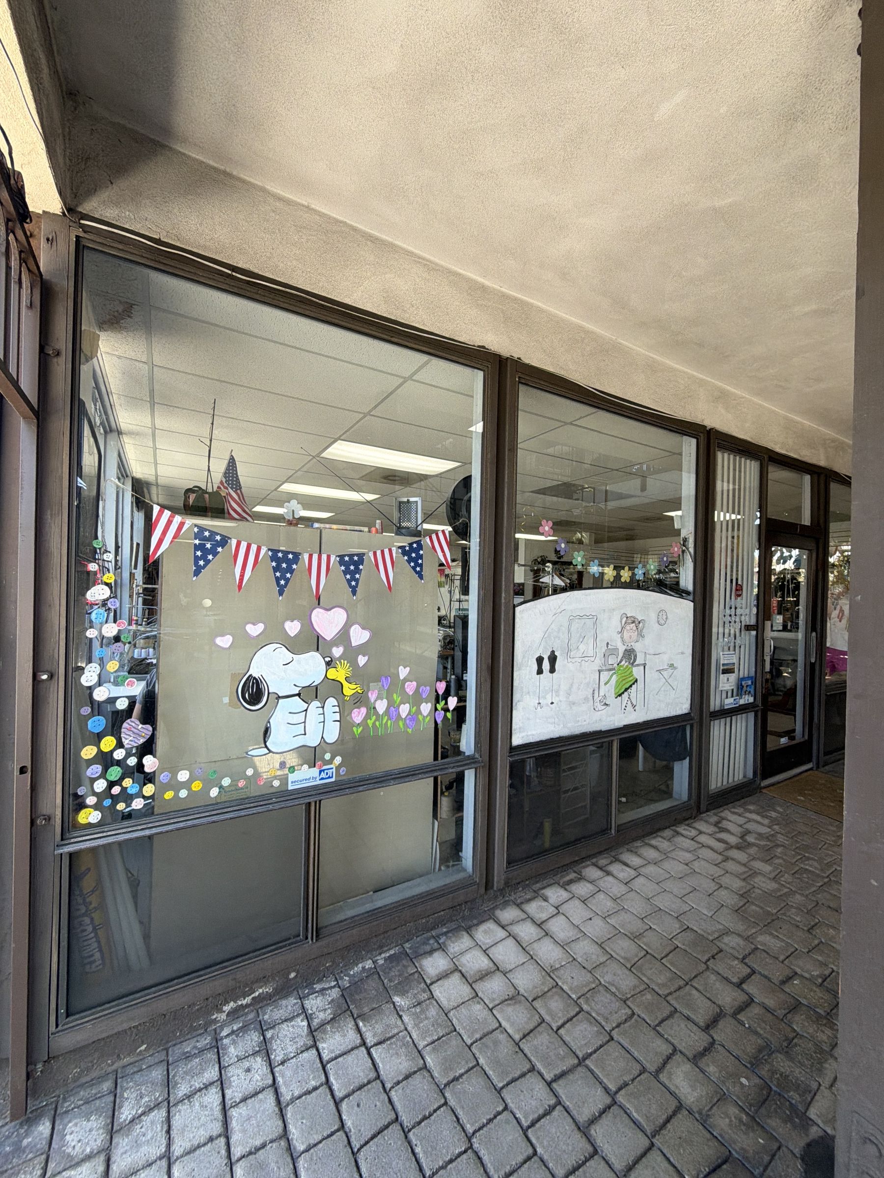 Shop front windows decorated with American flag bunting